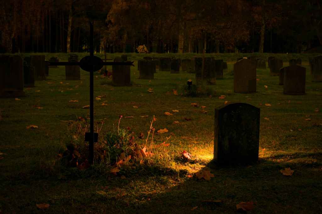 Image of graveyard at night
